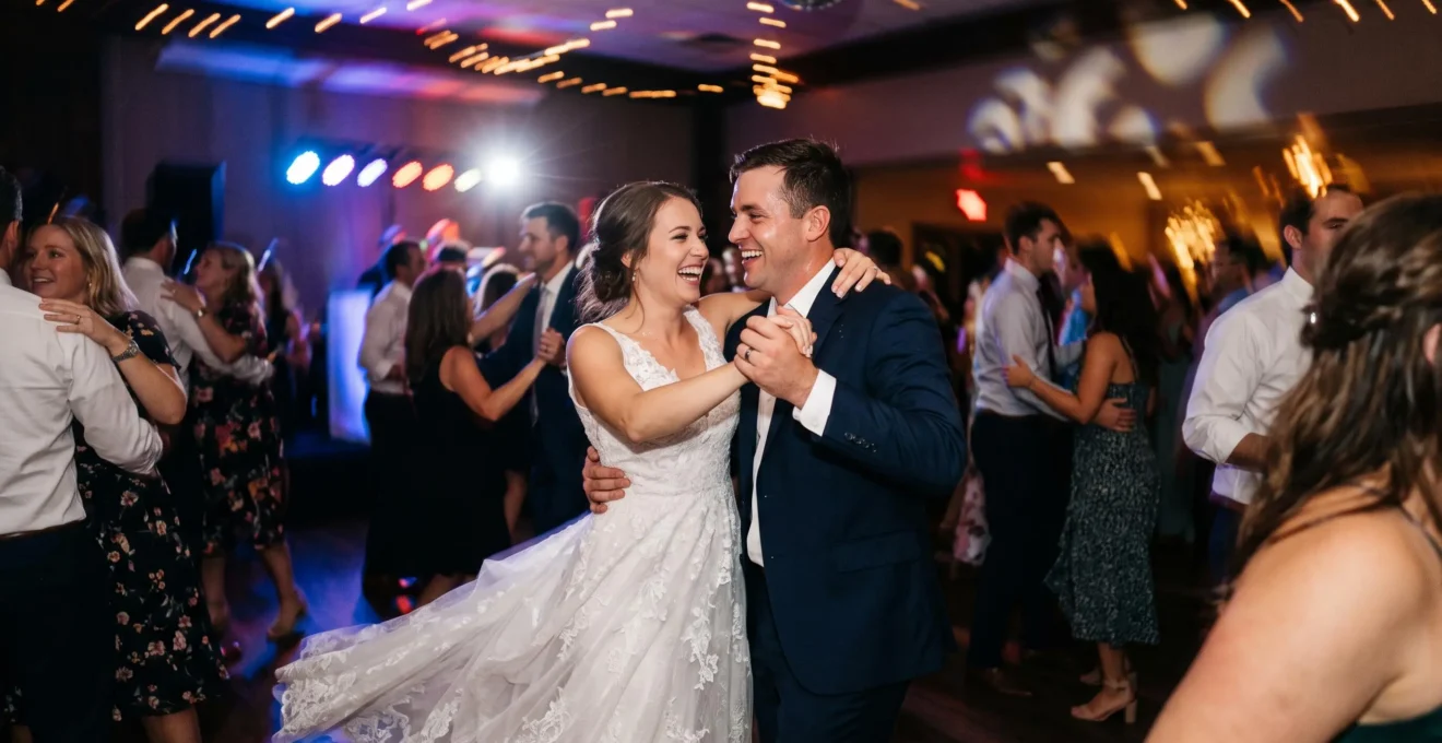 Wide editorial photograph of a wedding couple dancing amid blurred light trails on a dance floor at night
